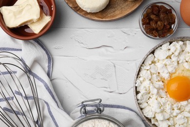 Photo of Flat lay composition with different ingredients on white textured table, space for text. Cooking cottage cheese pancakes