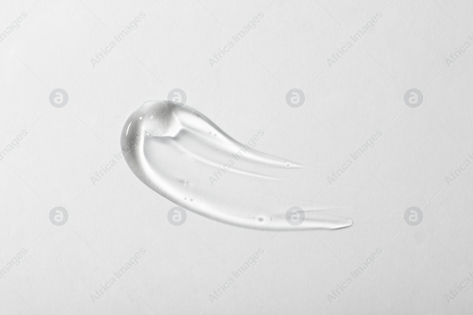 Photo of Sample of cosmetic gel on white background, top view