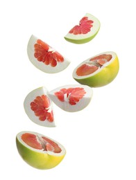 Fresh pomelo fruits falling on white background