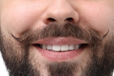 Happy man with mustache on white background, closeup