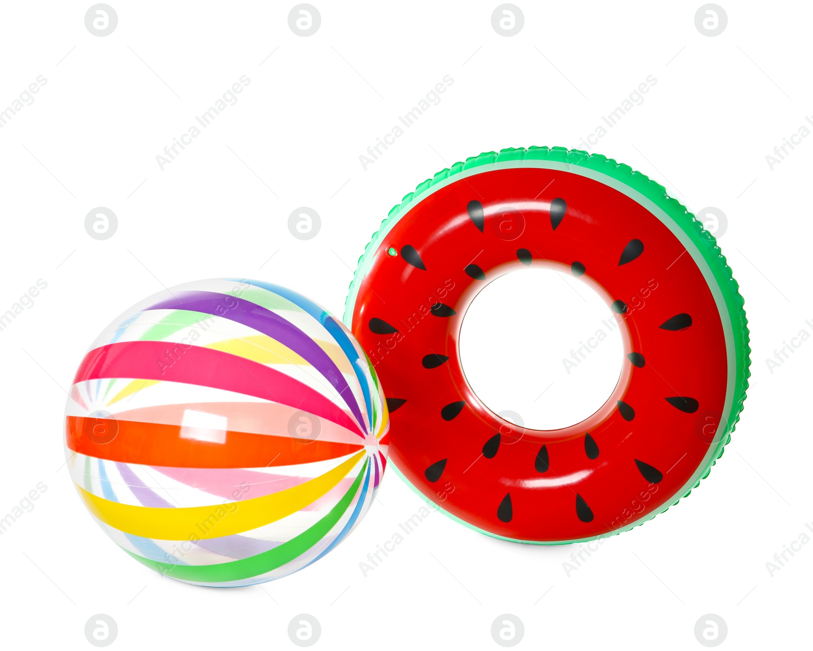 Photo of Inflatable ring and ball on white background. Summer holidays