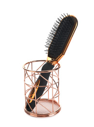 Photo of New modern hair brush in metal holder isolated on white