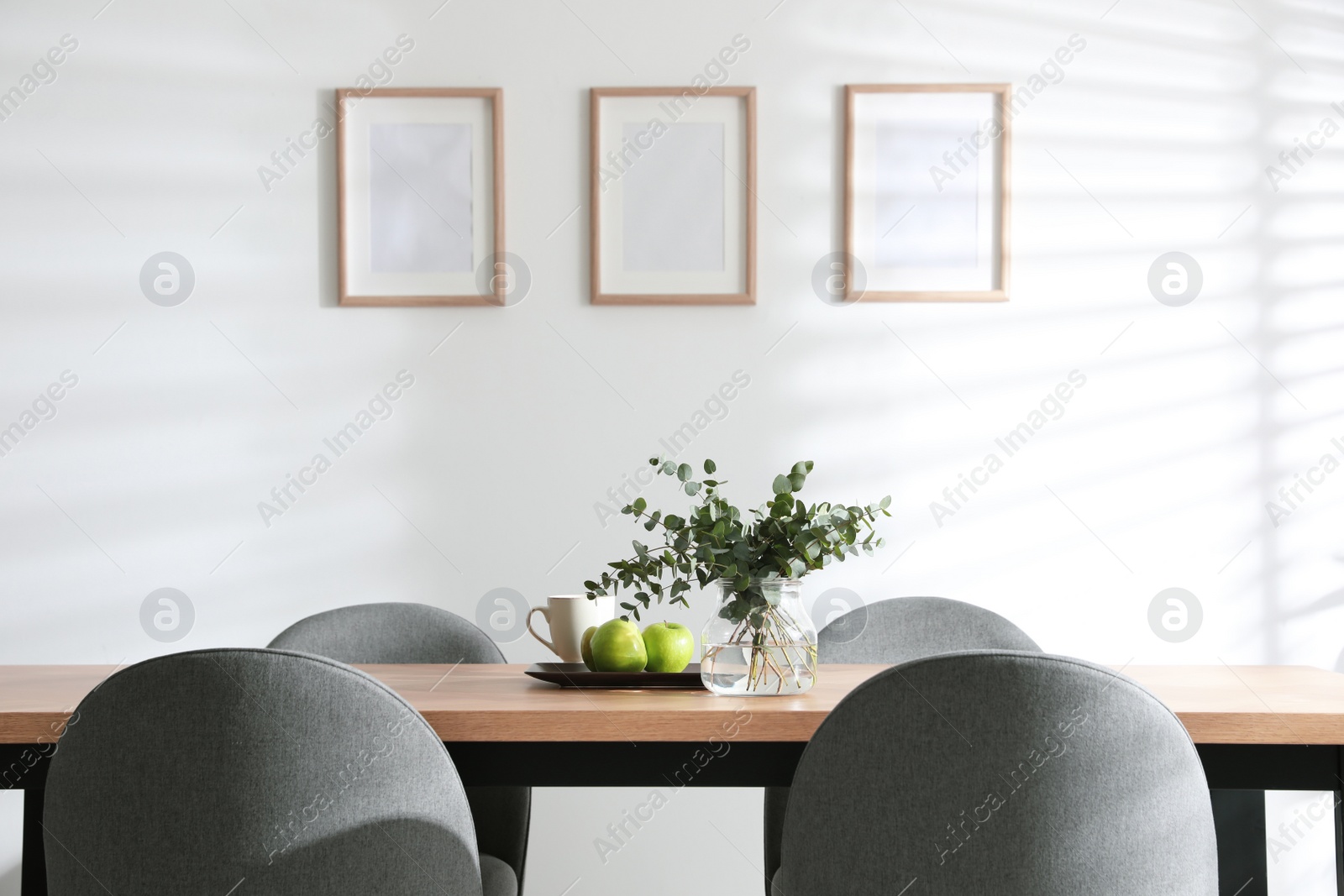 Photo of Stylish room interior with table and chairs. Idea for design