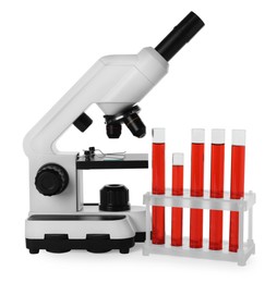 Photo of Test tubes with red liquid and microscope isolated on white
