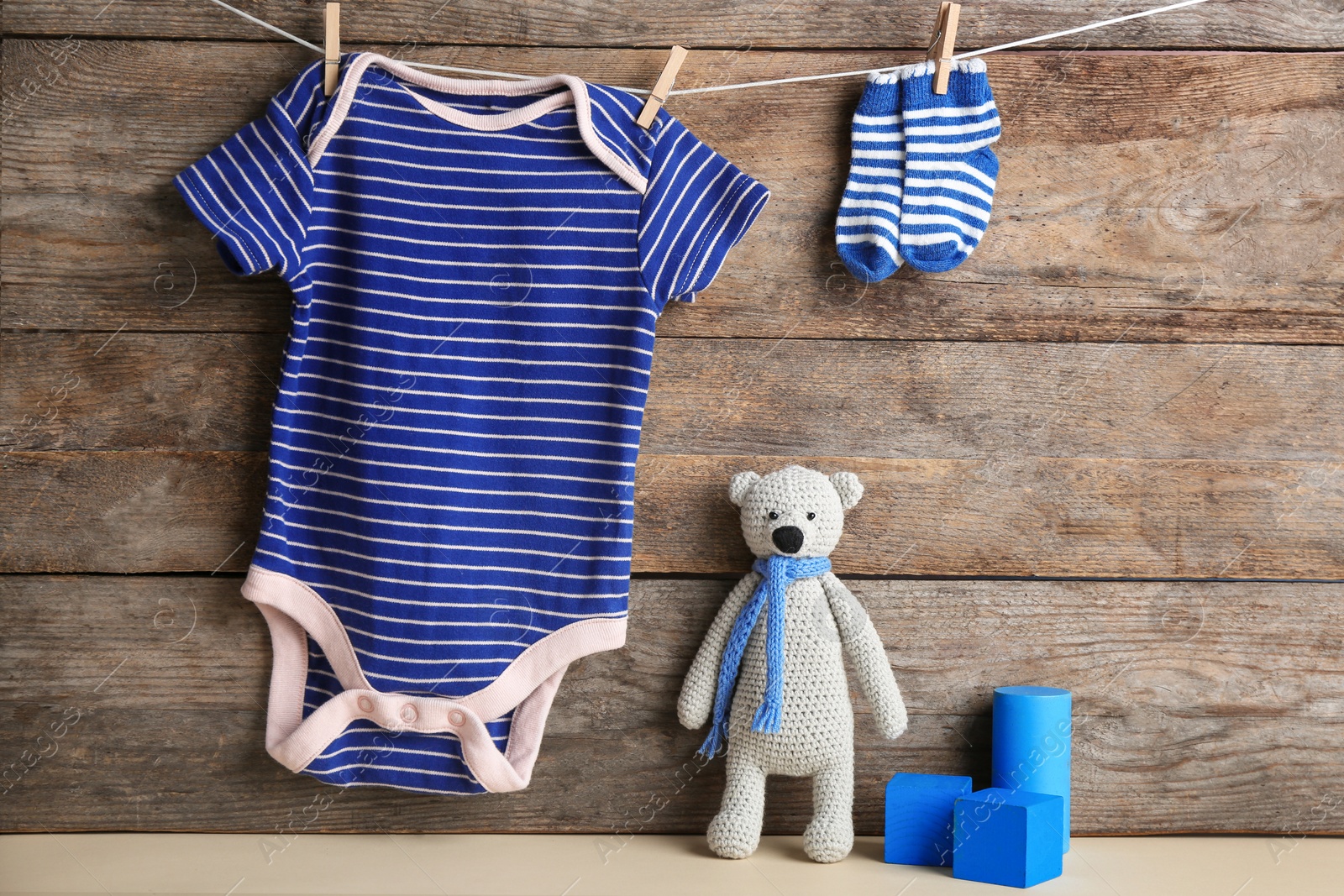 Photo of Composition with baby accessories on wooden background