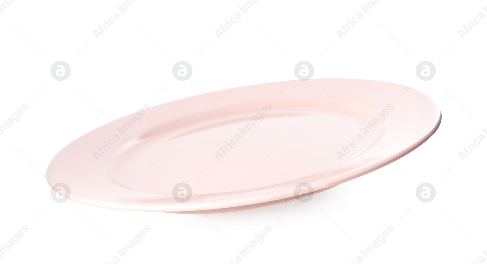 Photo of Clean light pink plate isolated on white