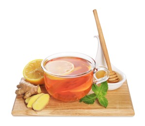 Photo of Wooden board with delicious ginger tea and ingredients on white background