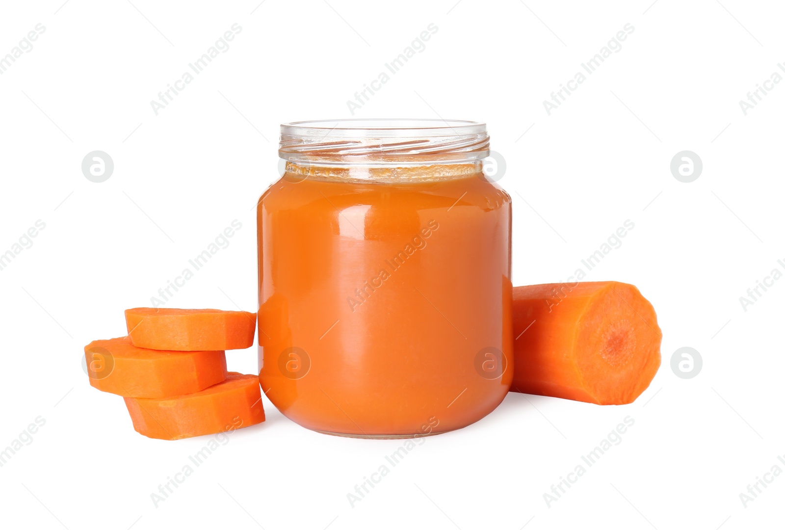 Photo of Tasty baby food in jar and fresh carrot isolated on white