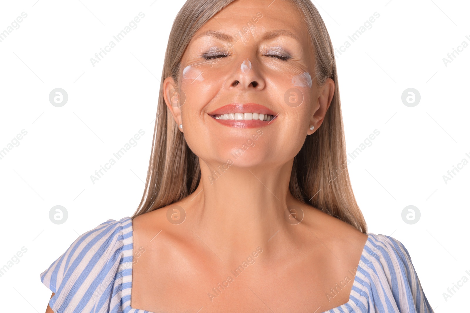 Photo of Beautiful senior woman with sun protection cream on her face isolated on white