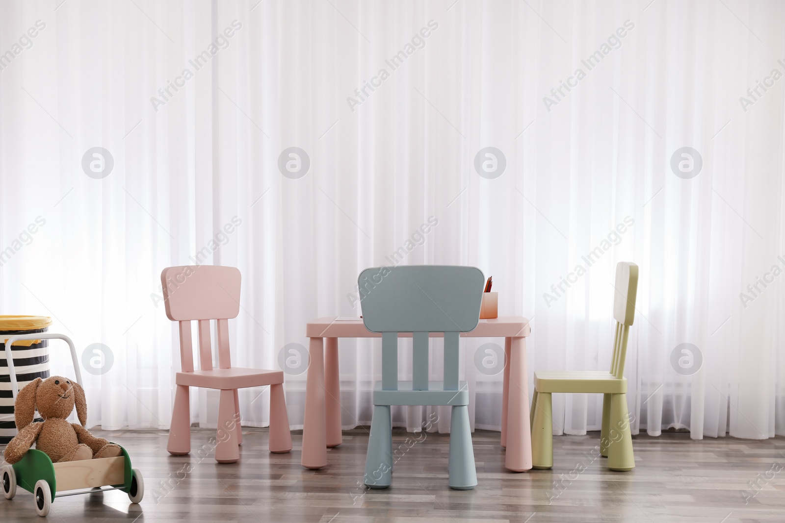 Photo of Modern child room interior with table and chairs