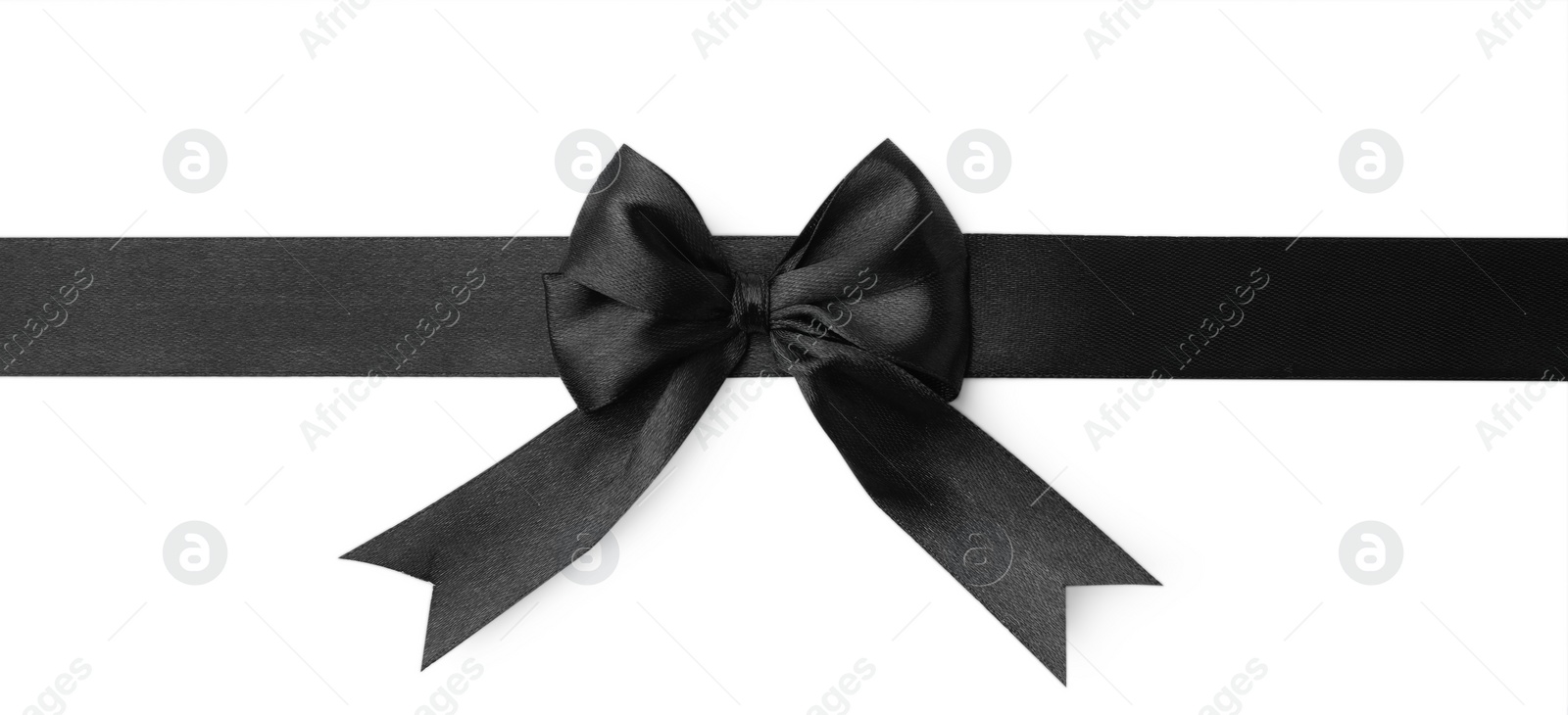 Photo of Black satin ribbon with bow isolated on white, top view