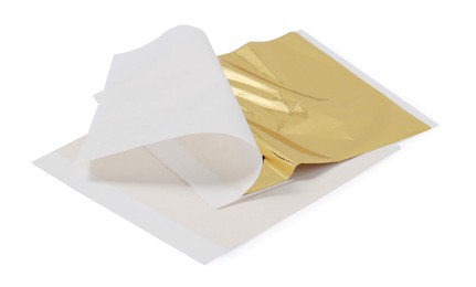Photo of Edible gold leaf sheets on white background