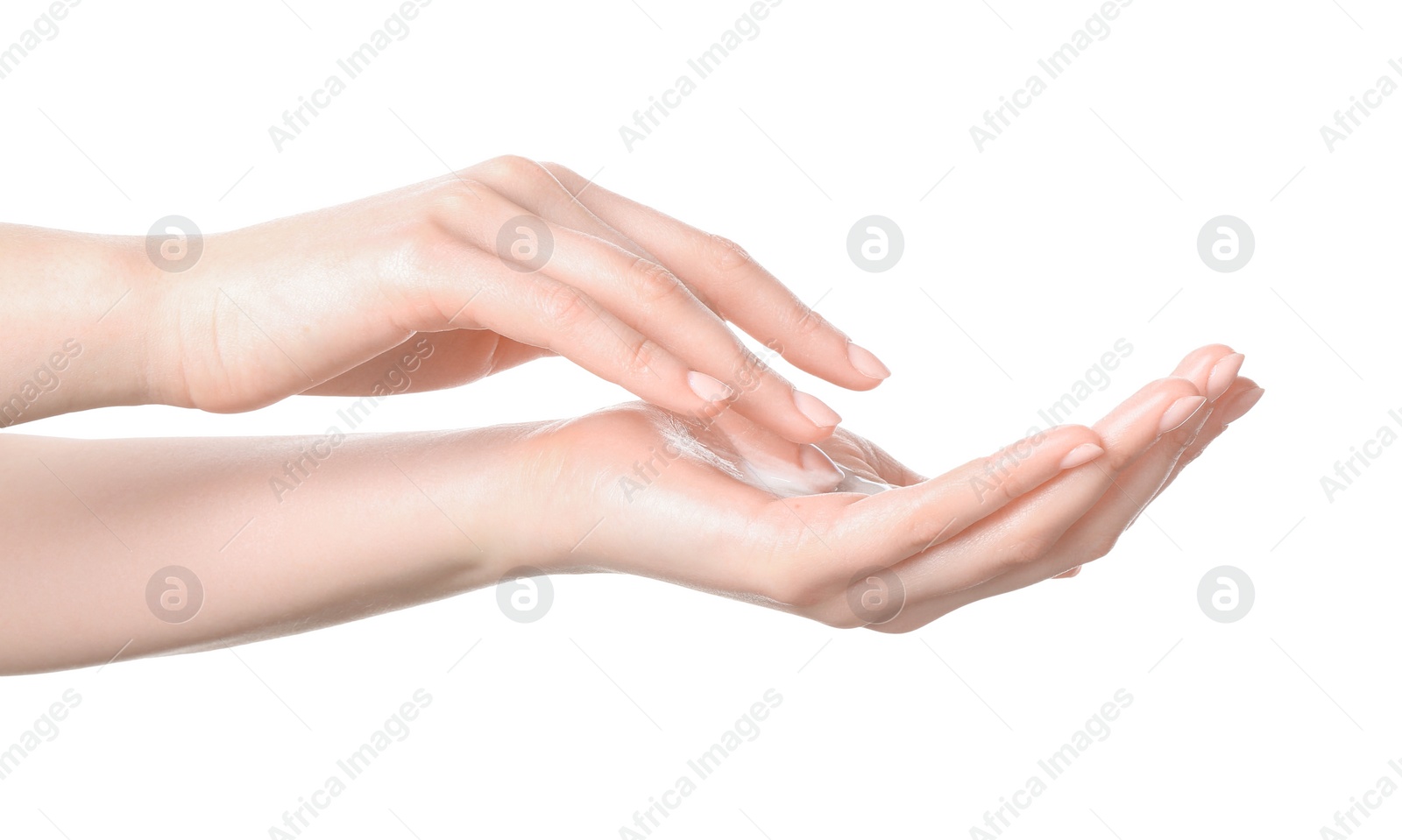 Photo of Woman applying cream on her hand against white background, closeup