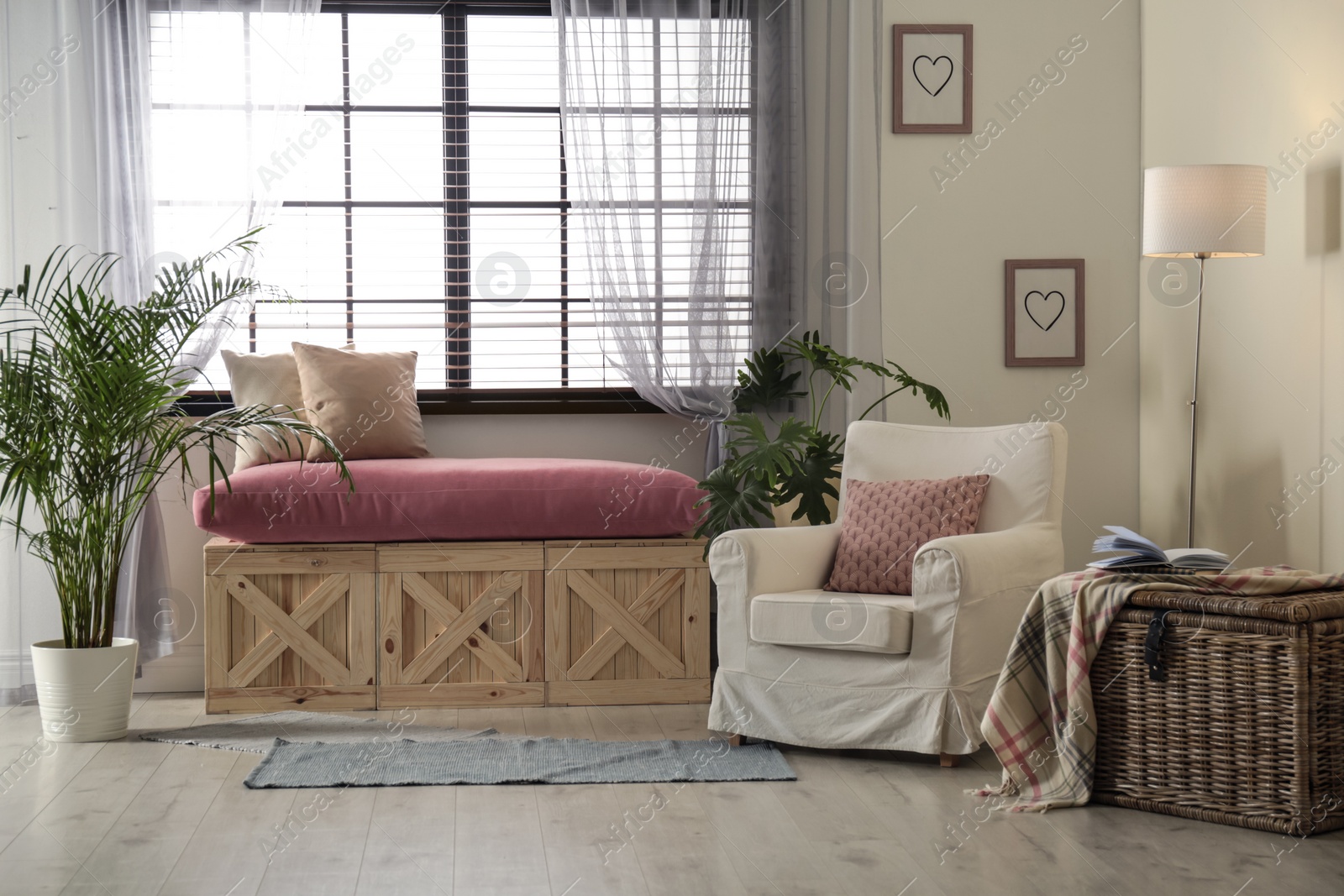 Photo of Elegant living room interior with comfortable armchair near window