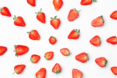 Photo of Composition with ripe red strawberries on light background