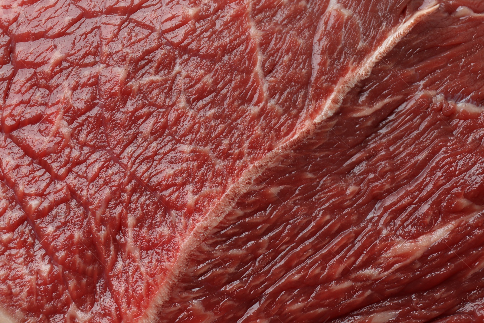 Photo of Texture of fresh beef meat as background, closeup