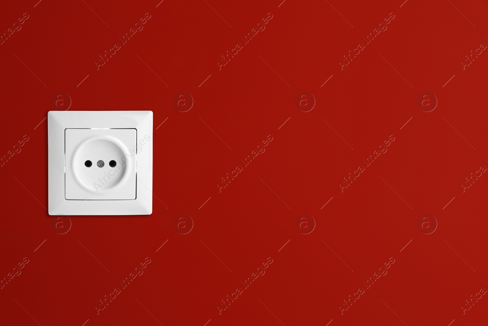 Red wall with power socket, space for text. Electrical supply Image of Red wall with power socket, space for text. Electrical supply