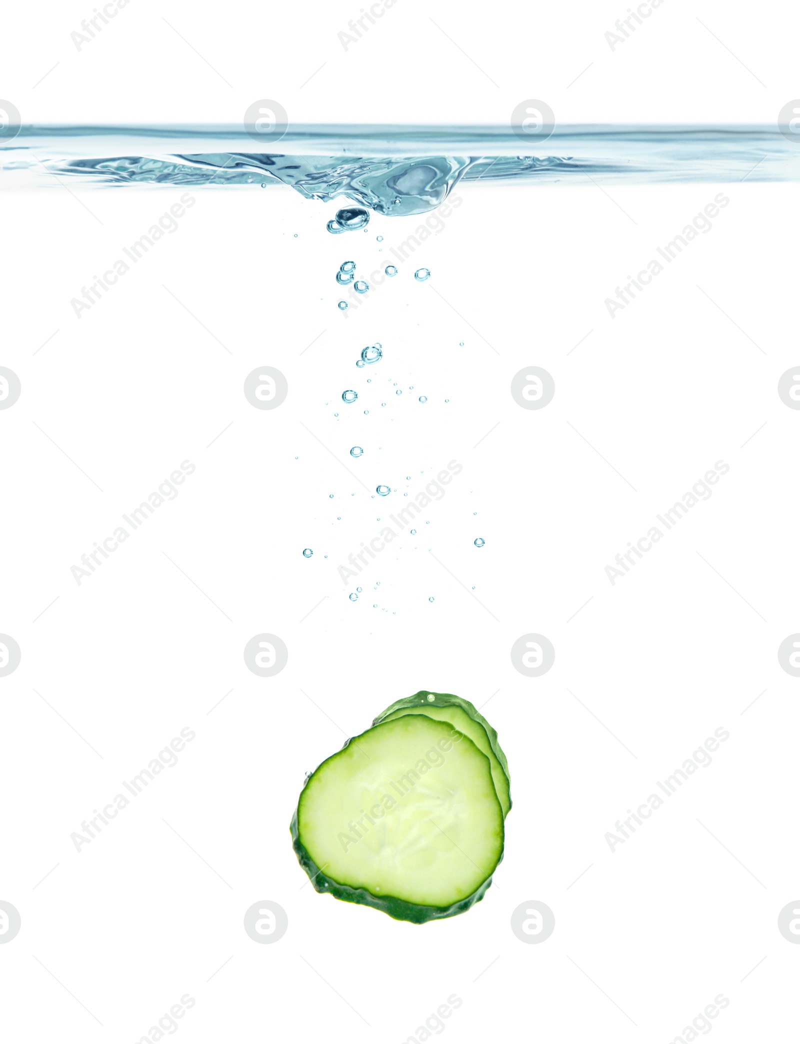 Photo of Fresh cucumber slice in water on white background