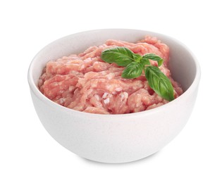 Photo of Raw chicken minced meat with basil in bowl on white background