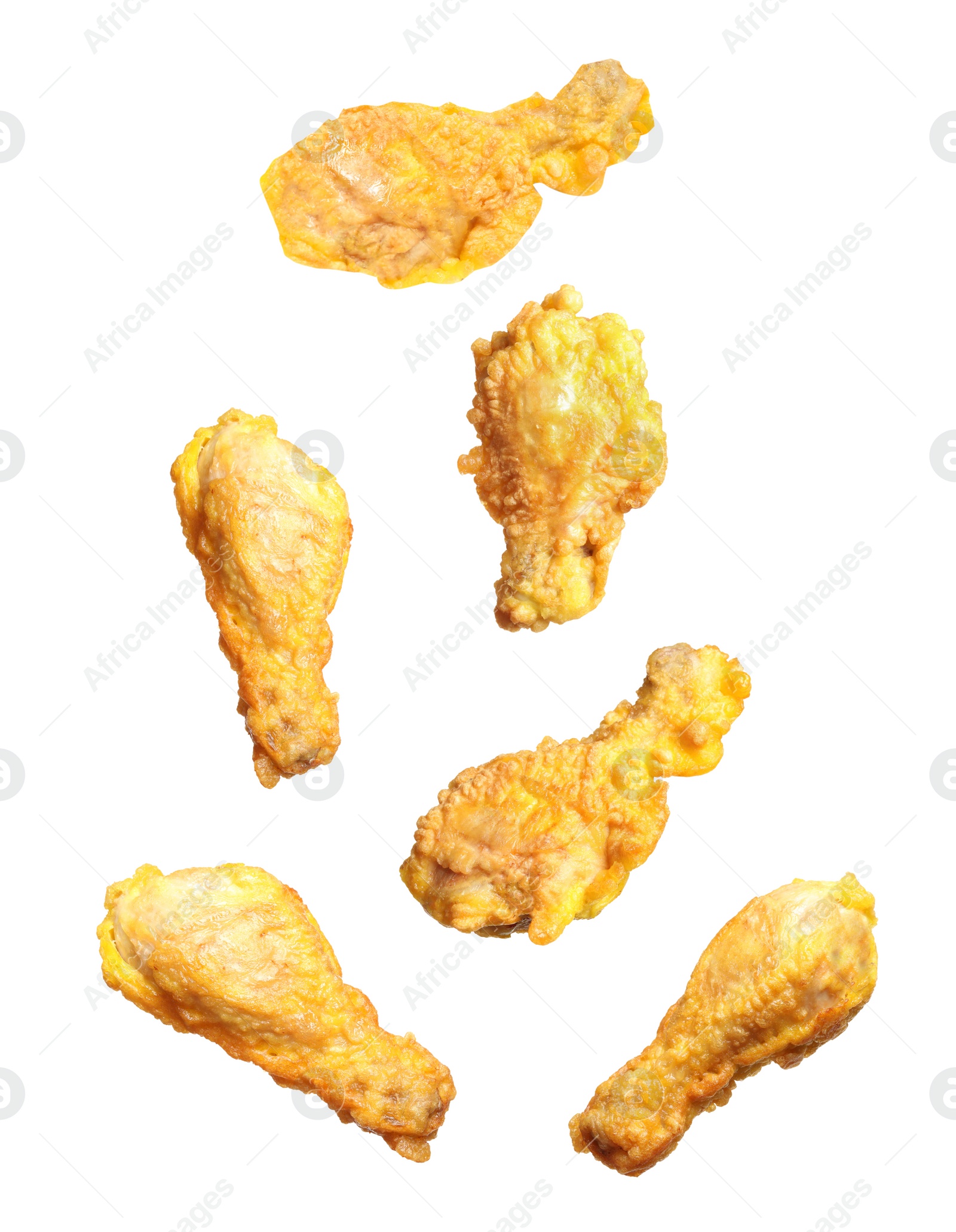 Image of Fresh fried chicken falling on white background