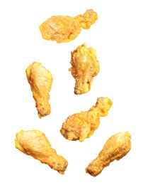 Image of Fresh fried chicken falling on white background