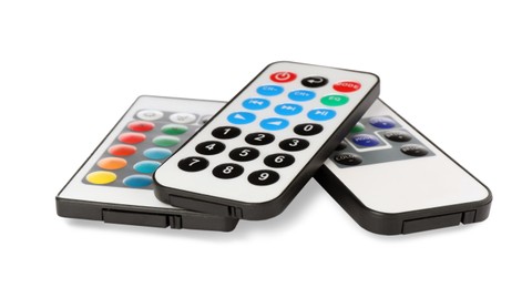 Different modern remote controls on white background