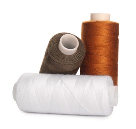 Photo of Different colorful sewing threads on white background