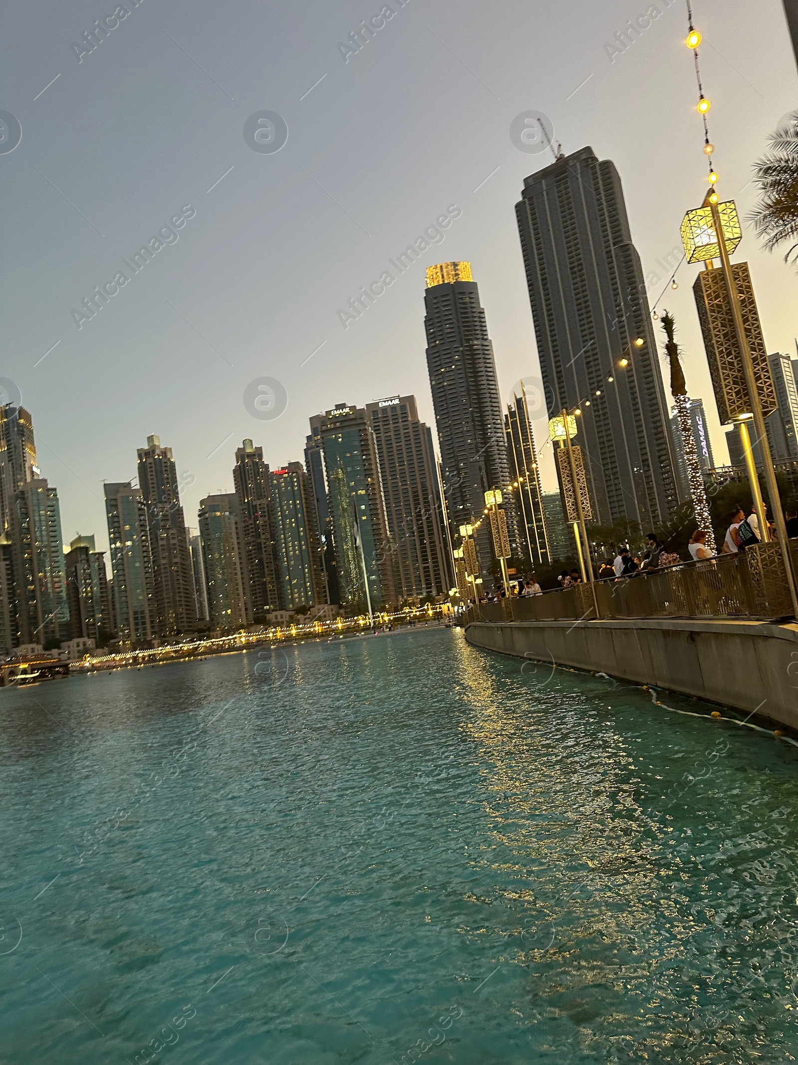 Photo of Dubai, United Arab Emirates - May 2, 2023: Beautiful modern buildings near embankment in city