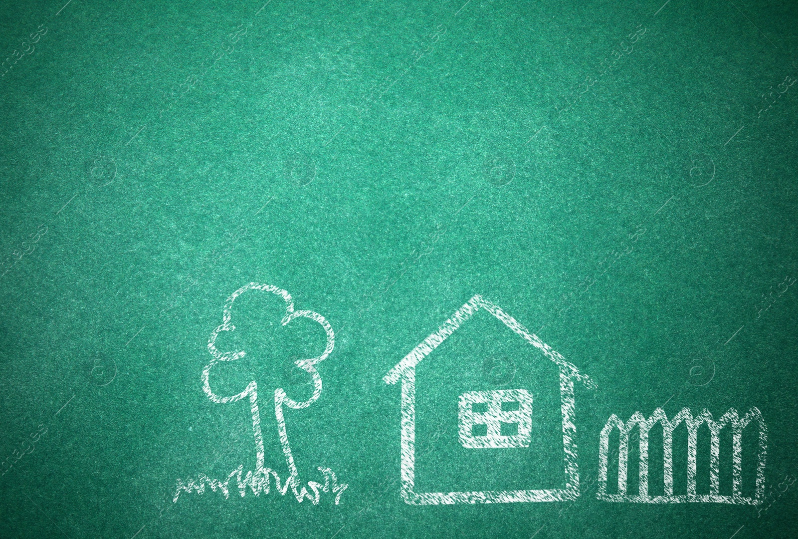 Image of House and tree drawn with chalk on school board