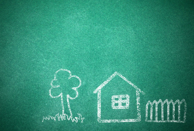 Image of House and tree drawn with chalk on school board