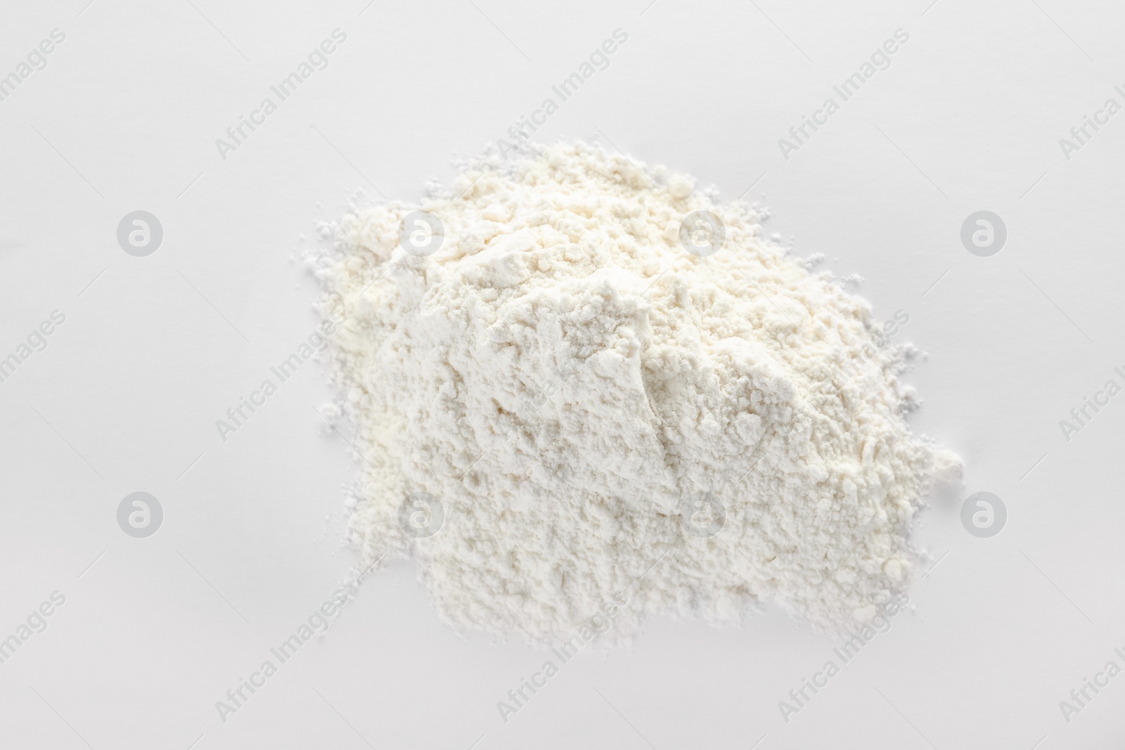 Photo of Pile of protein powder isolated on white, top view