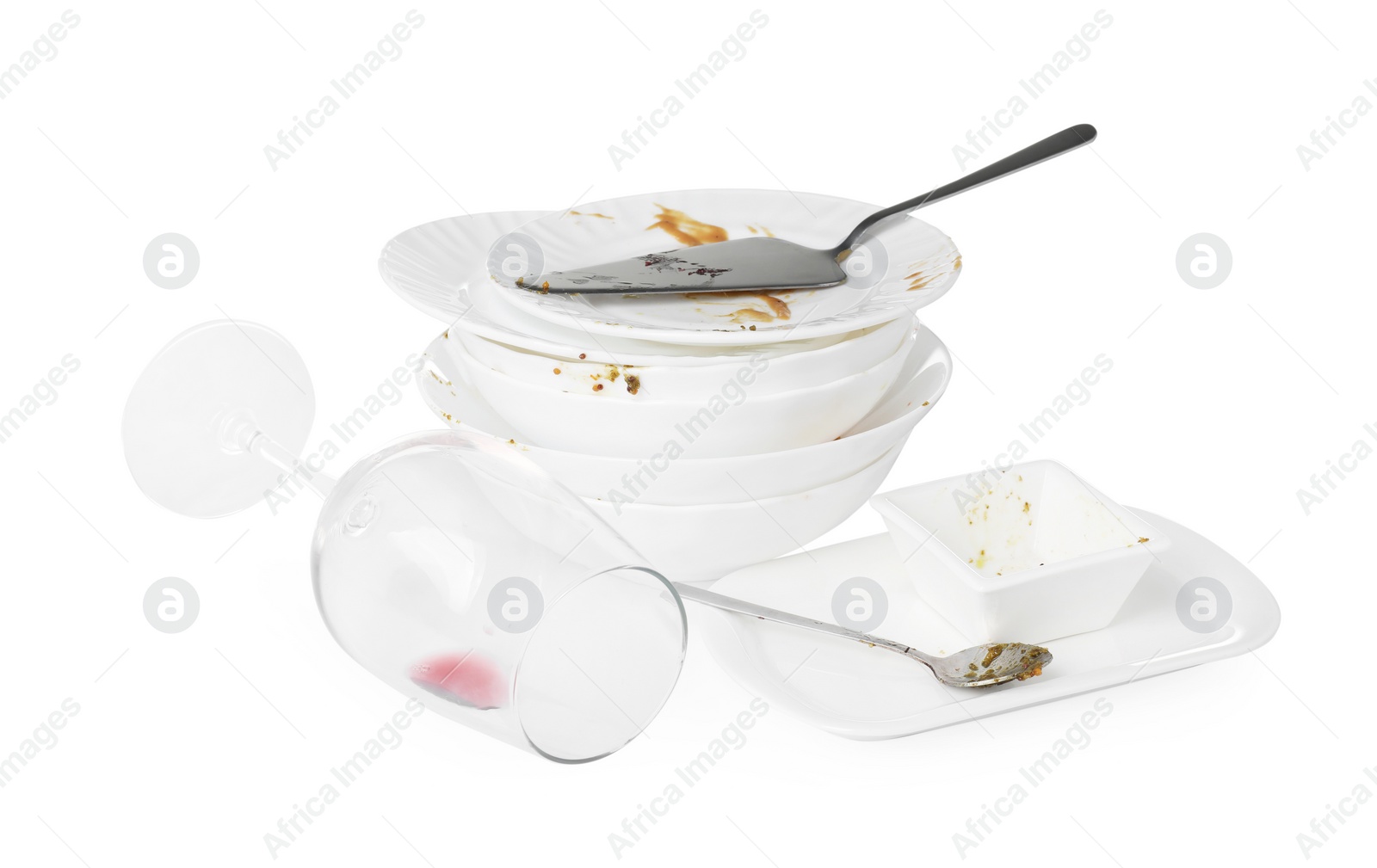 Photo of Set of dirty dishes isolated on white