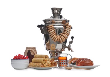 Traditional Russian samovar and treats on white background