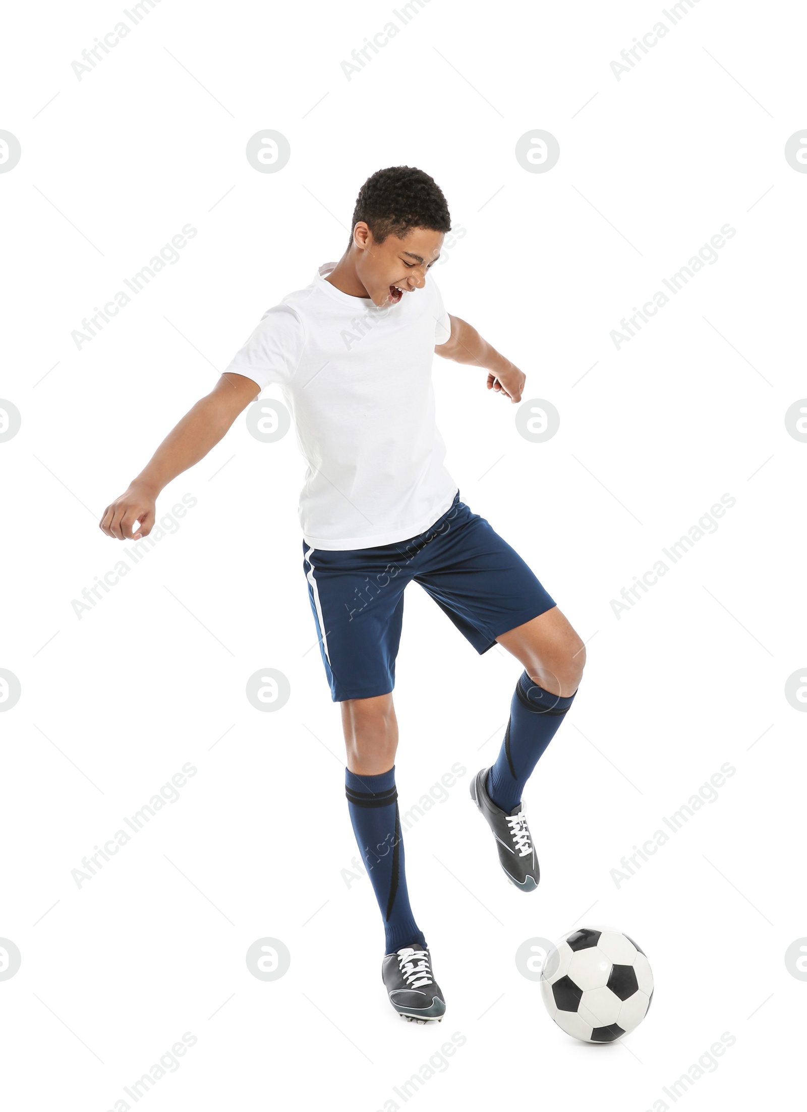 Photo of Teenage African-American boy playing football on white background