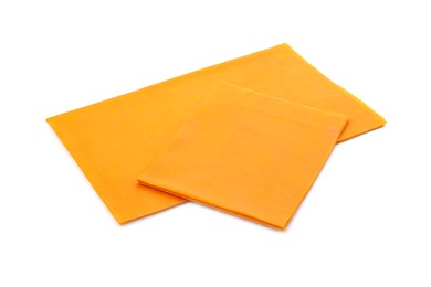 Orange reusable beeswax food wraps on white background