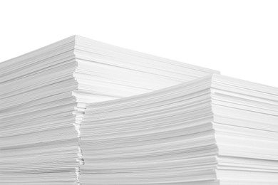 Photo of Stacks of paper sheets on white background, closeup