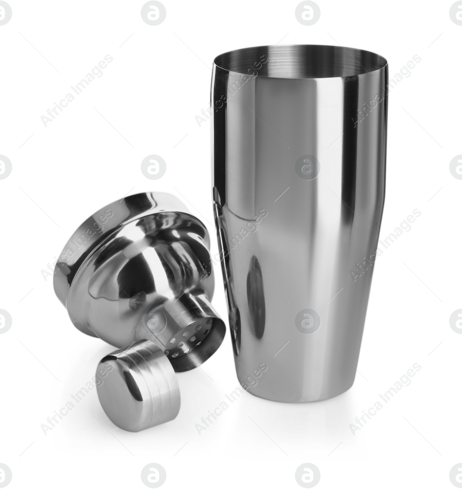 Photo of Metal cocktail shaker, strainer and cap isolated on white