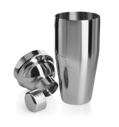 Photo of Metal cocktail shaker, strainer and cap isolated on white