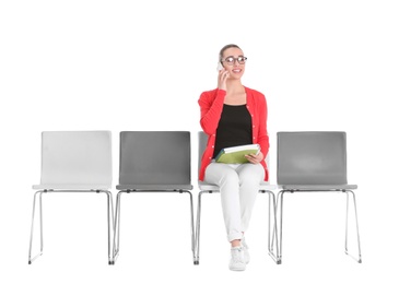 Young woman waiting for job interview on white background