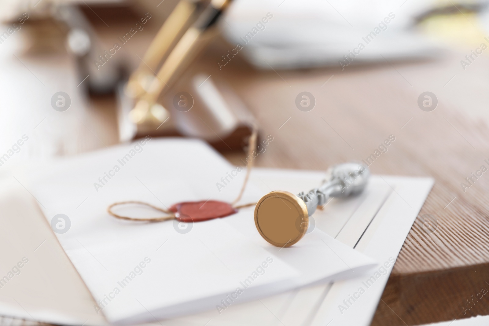 Photo of Vintage notary stamp and documents on desk, closeup