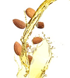 Image of Organic almond oil and tasty nuts flying on white background