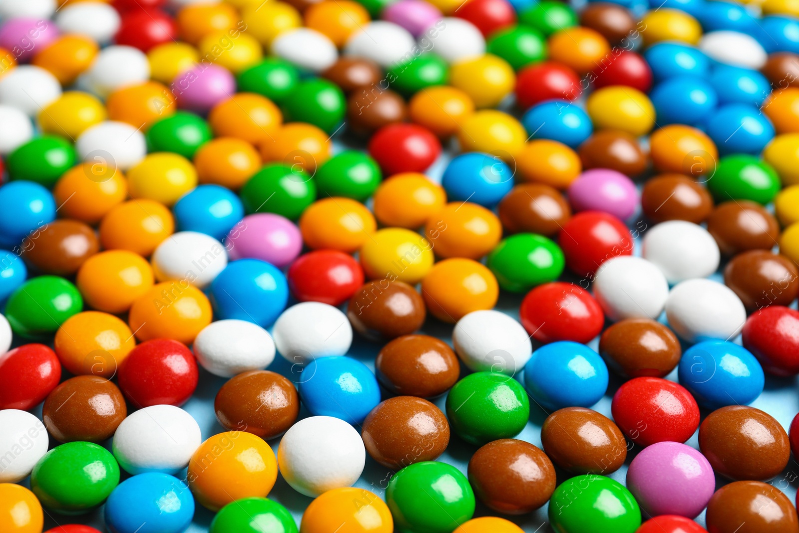 Photo of Many colorful delicious candies as background, closeup