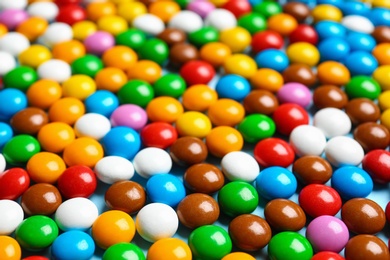 Photo of Many colorful delicious candies as background, closeup