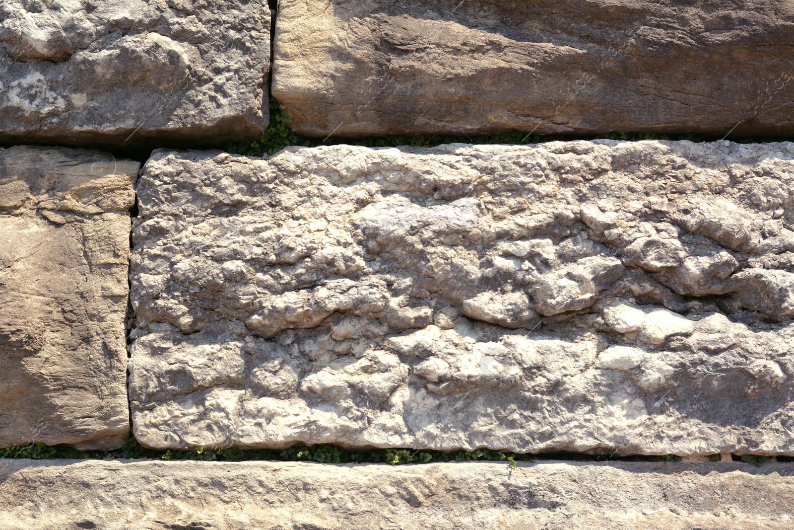 Photo of Texture of old stone wall as background, closeup