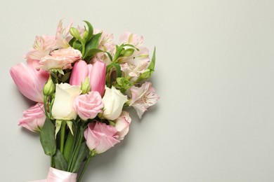 Photo of Happy Mother's Day. Bouquet of beautiful flowers on light grey background, top view. Space for text