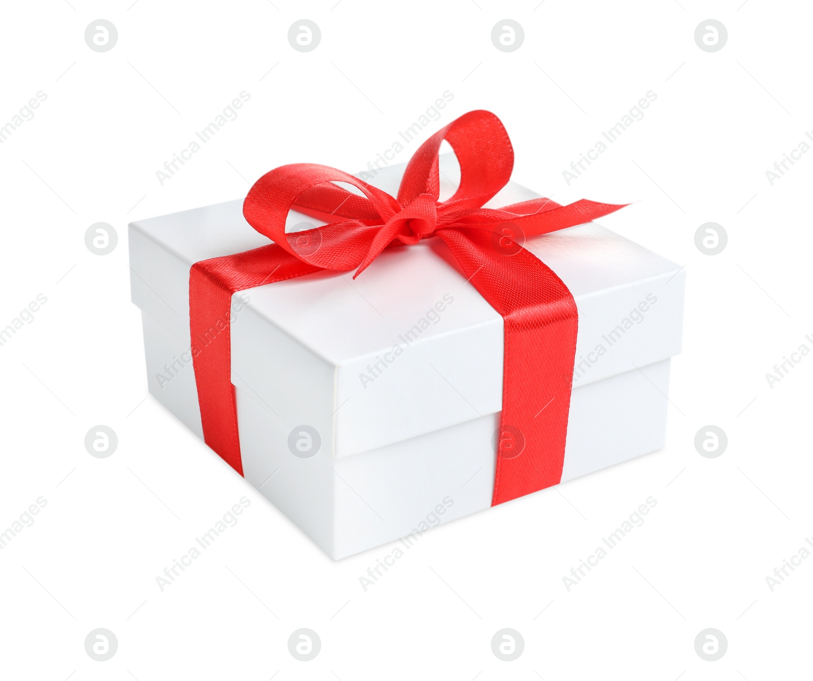 Photo of Christmas gift. Box with red ribbon bow on white background