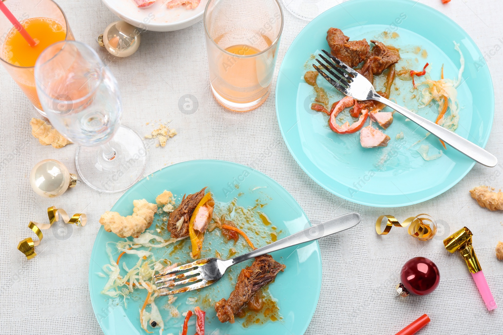 Photo of Composition with food leftovers after party on table, above view