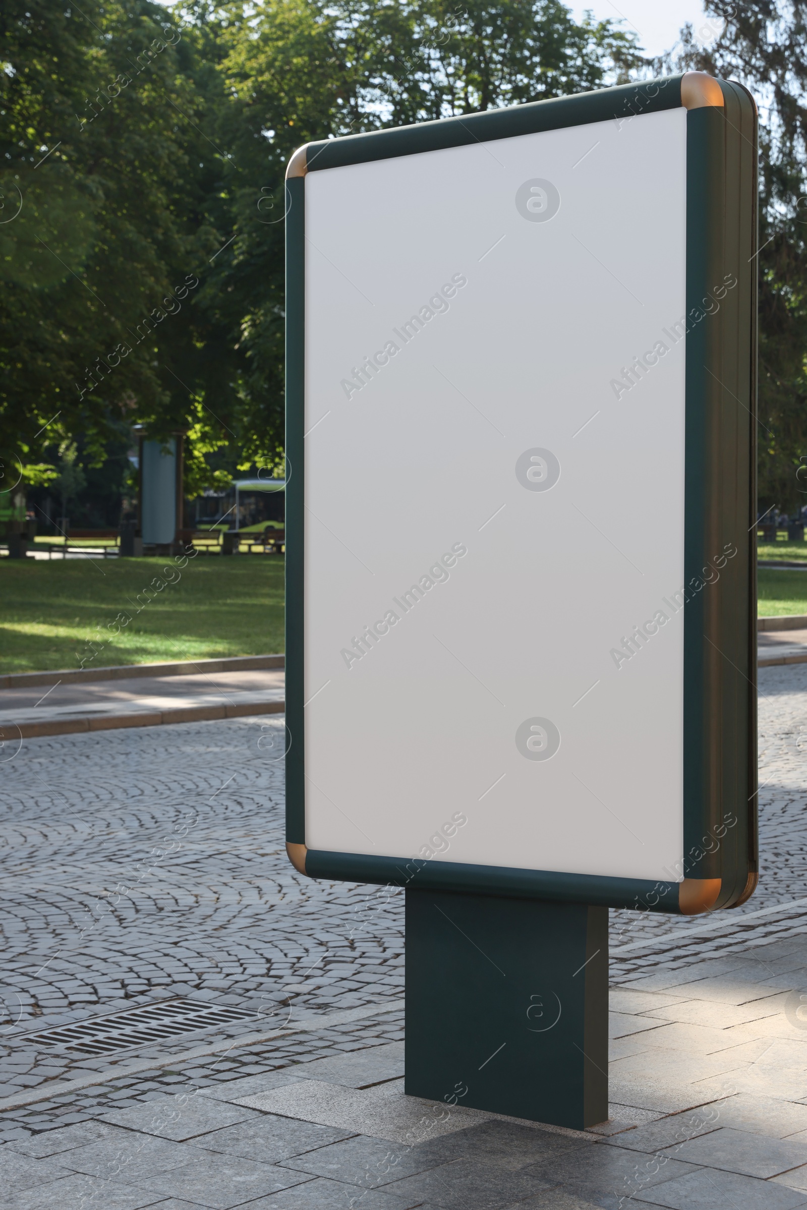 Photo of Blank citylight poster on street in city. Space for design