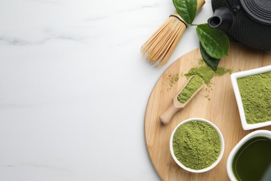 Photo of Flat lay composition with green matcha powder on white marble table, space for text