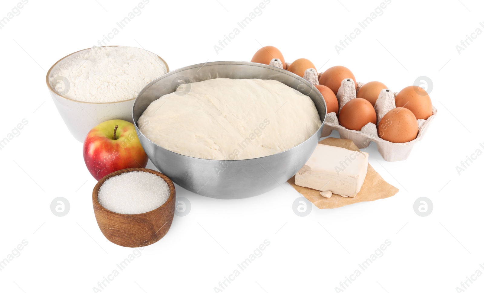 Photo of Fresh yeast dough and ingredients for cake on white background